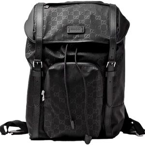 Authentic Gucci Nylon Monogram Medium Light Double Buckle Backpack in Black.